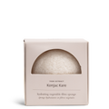 Konjac hydrating vegetable fibre sponge in its packaging, showing a crescent moon piece of the circular sponge